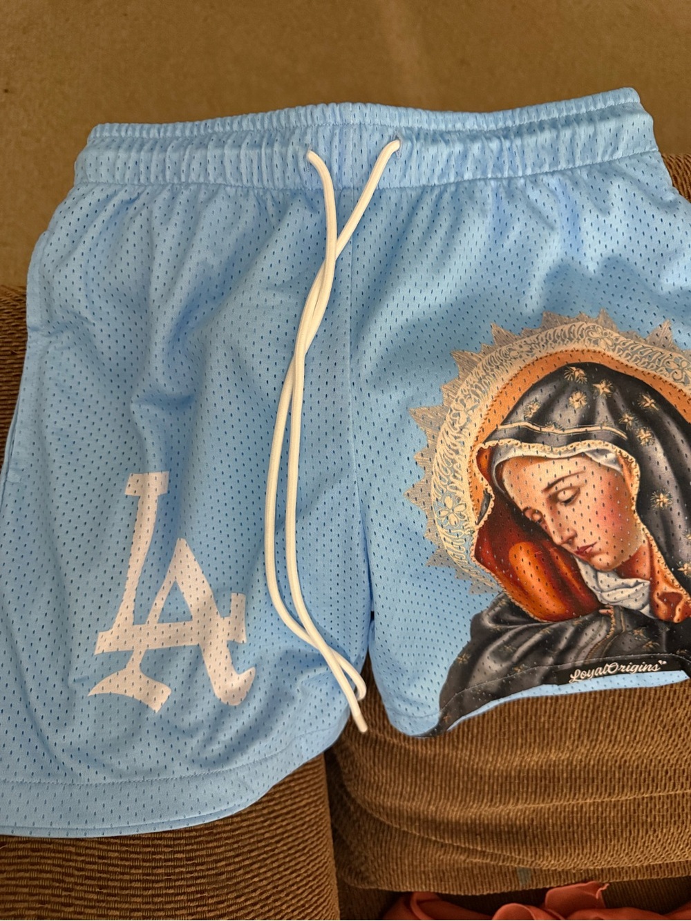 Light Blue Athletic Mesh Shorts with Religious Graphic